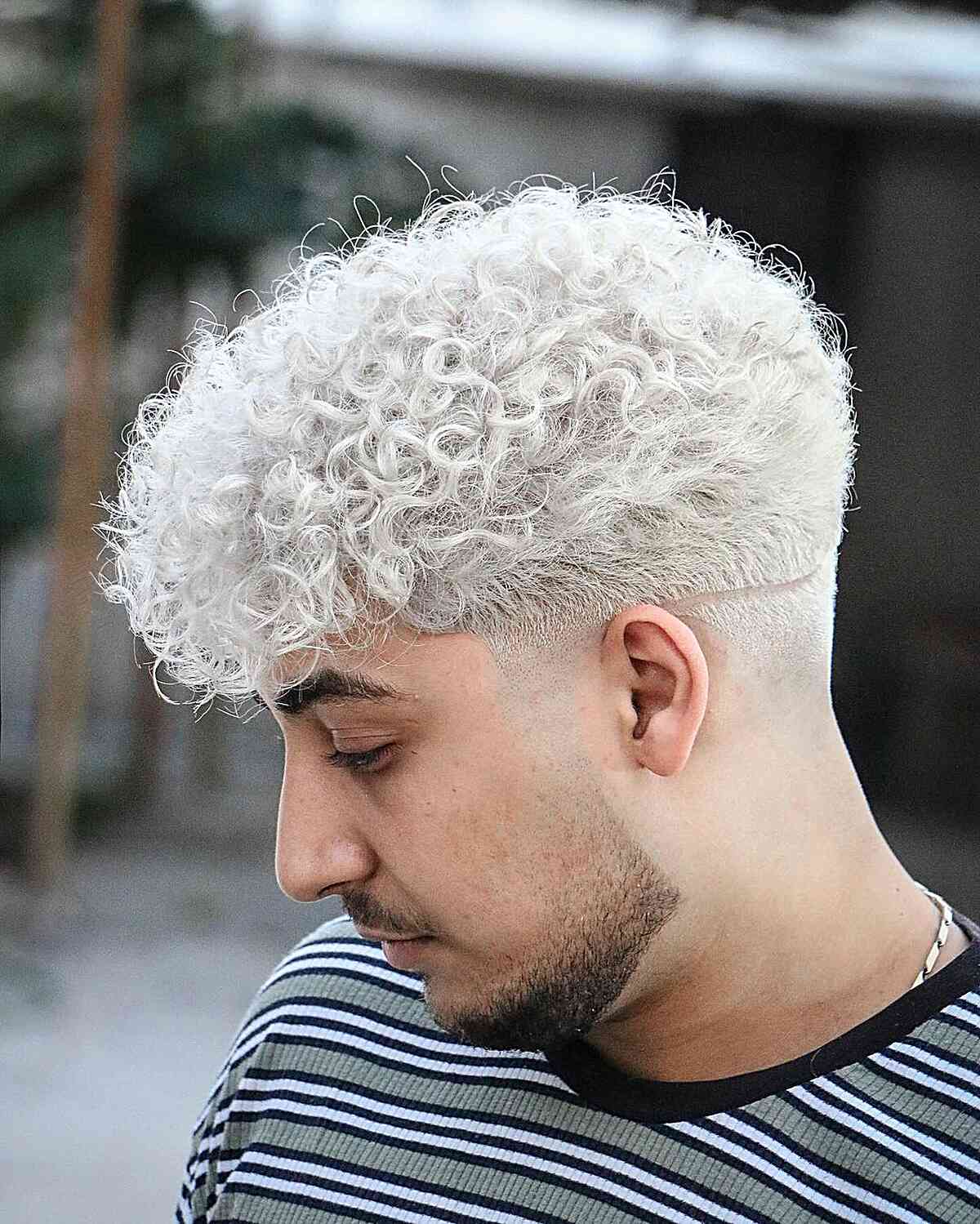 platinum curly hair man