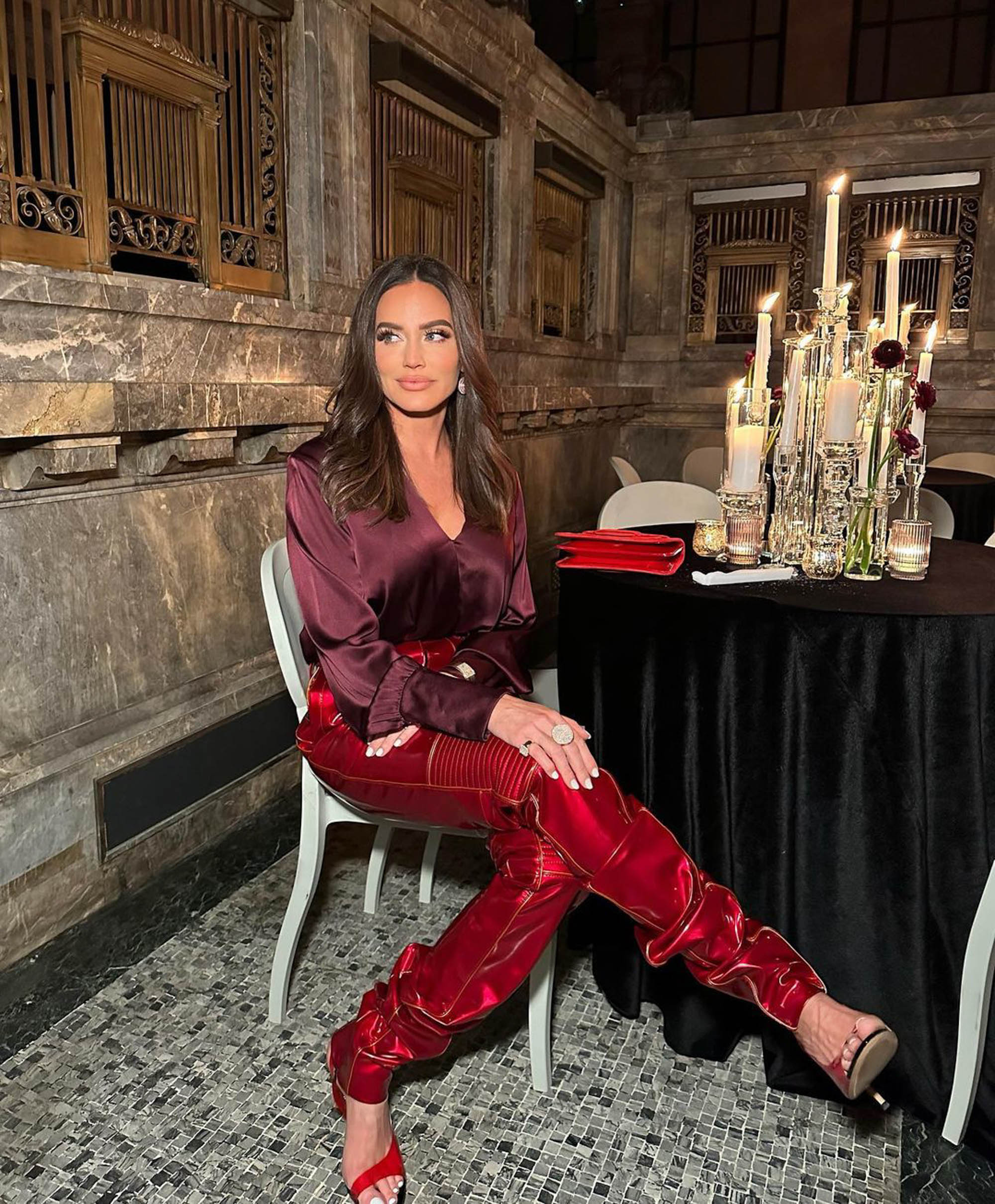 lesbian on red leather couch