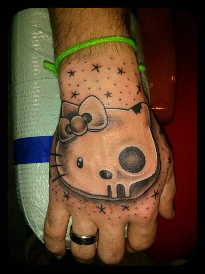 hello kitty hand tattoo