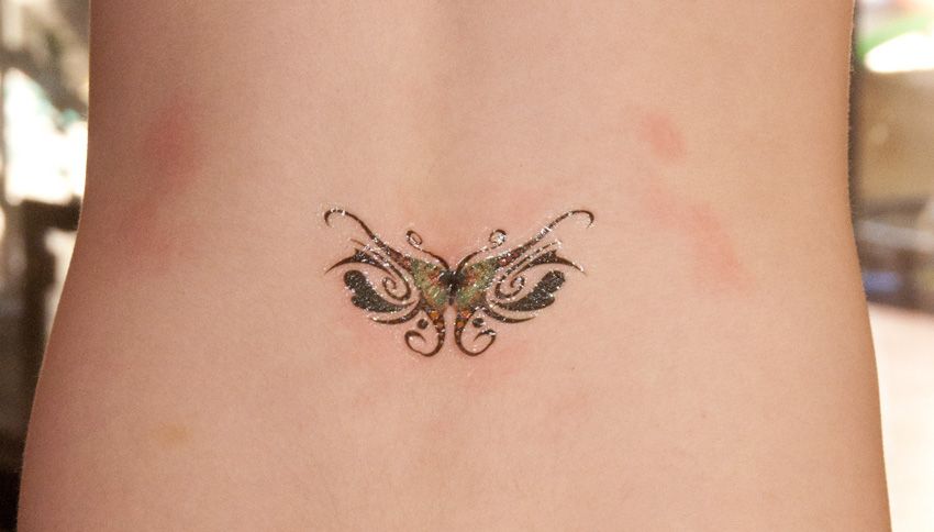 butterfly belly button tattoo