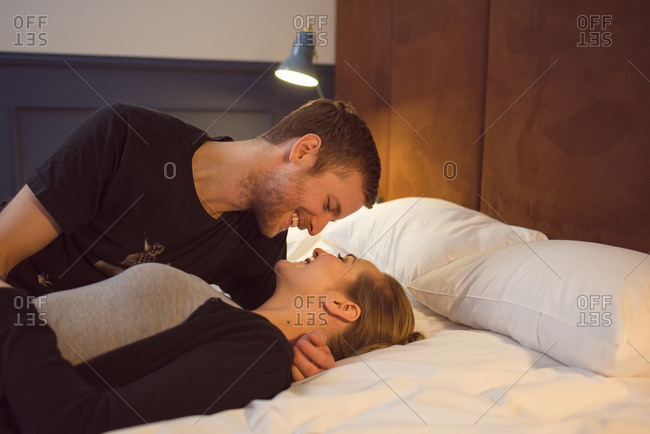 picture of man and woman cuddling in bed