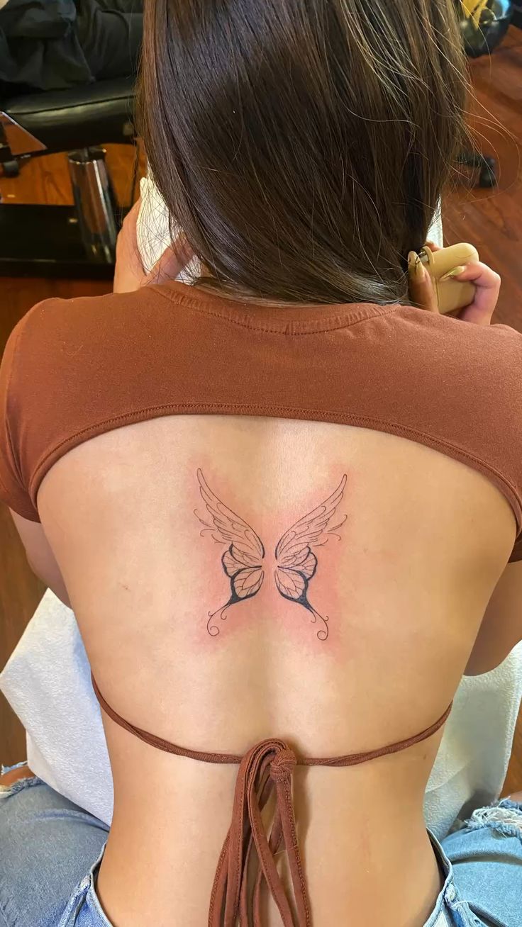 chrissanne faith recommends butterfly wings back tattoo pic