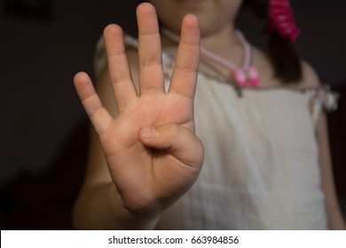 cat burgess recommends girl holding up 4 fingers pic