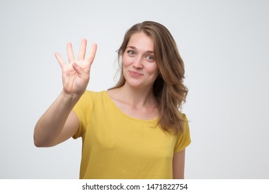 christopher moffett add girl holding up 4 fingers photo