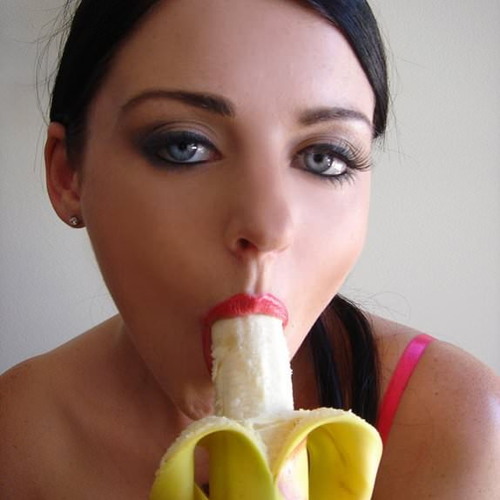 girl sucking on banana