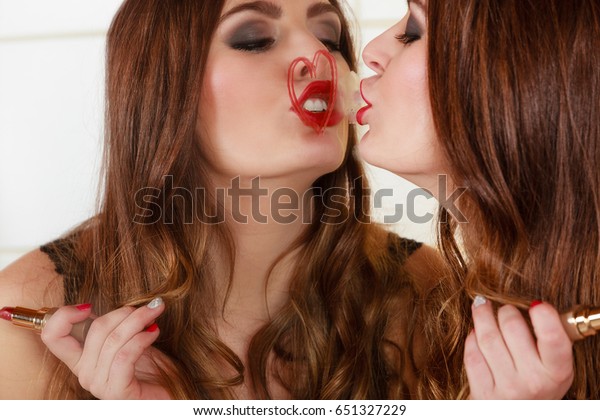 girls kissing in bathroom