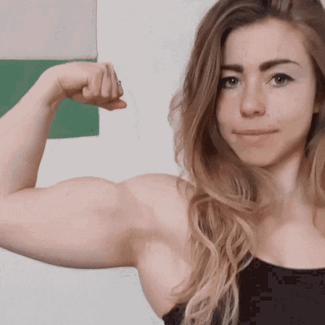 calkin share muscle girl flexing biceps photos