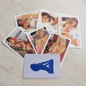 nude women playing cards